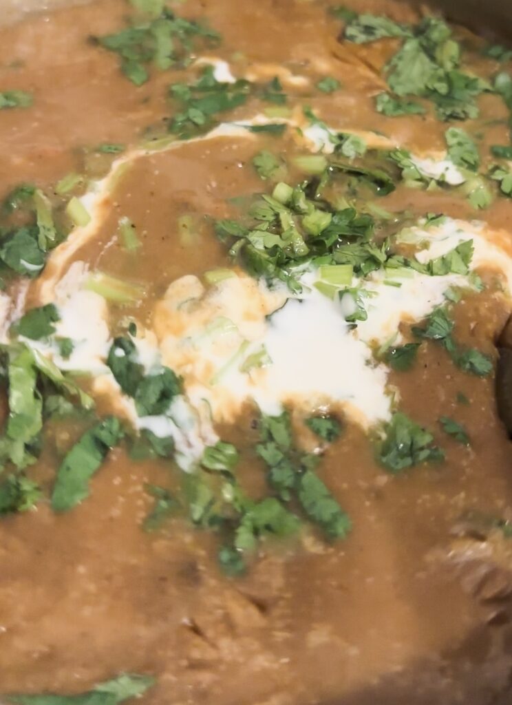 Dal Makhani, a beloved North Indian dish, combines the richness of black lentils and kidney beans in a creamy, spiced gravy.